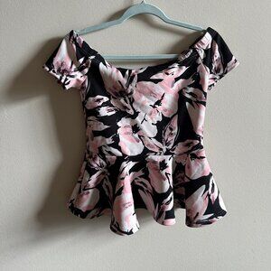 Revamped off shoulder peplum. Floral pitch, black and white color size medium